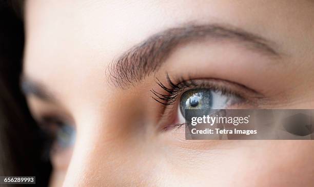 close up of young woman with blue eyes - blue eyes stock pictures, royalty-free photos & images