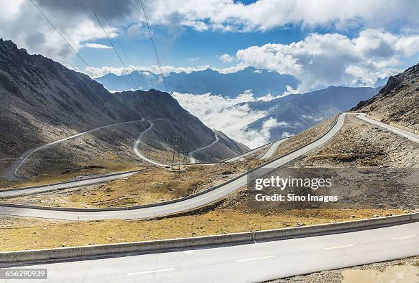 winding mountain road - bumpy stock pictures, royalty-free photos & images