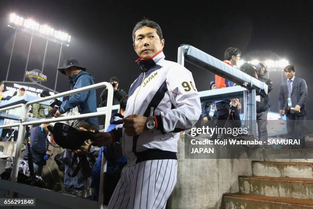 Manager Hiroki Kokubo of Japan leaves after his team's defeat by the United States after the World Baseball Classic Championship Round Game 2 between...