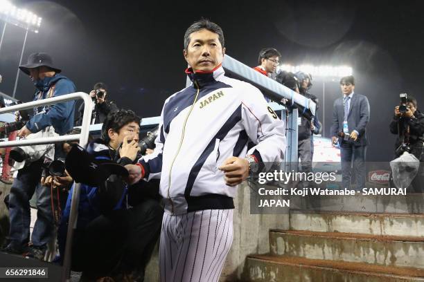 Manager Hiroki Kokubo of Japan leaves after his team's defeat by the United States after the World Baseball Classic Championship Round Game 2 between...