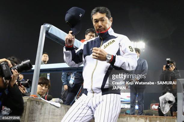 Manager Hiroki Kokubo of Japan leaves after his team's defeat by the United States after the World Baseball Classic Championship Round Game 2 between...