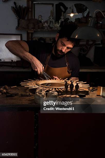 craftsman manufacturing a mirror in his workshop - basket weaving stock pictures, royalty-free photos & images