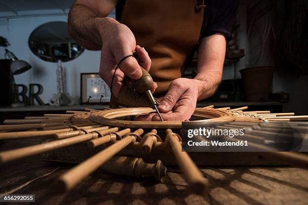 craftsman manufacturing a mirror in his workshop - basket weaving stock pictures, royalty-free photos & images