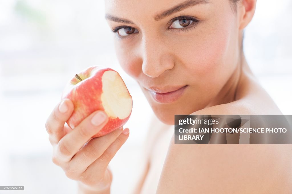 Woman holding an apple