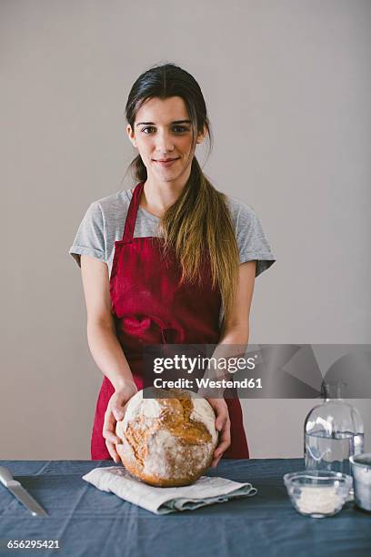 woman with hand made bread - baker smelling bread stock pictures, royalty-free photos & images