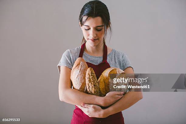 woman with hand made bread - homemade loaf of bread stock pictures, royalty-free photos & images