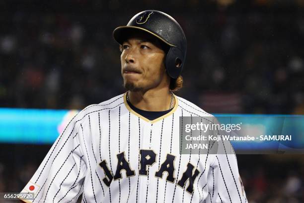 Infielder Nobuhiro Matsuda of Japan walks to the dugout after striking out in the bottom of the ninth inning during the World Baseball Classic...