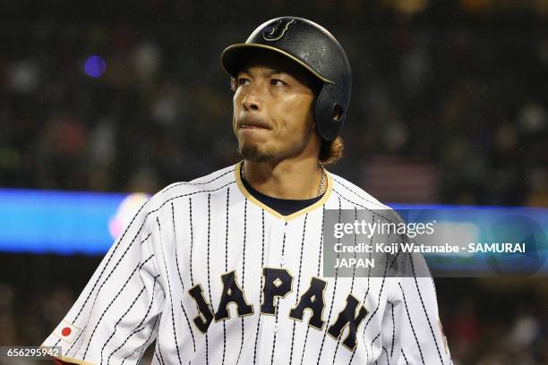 Infielder Nobuhiro Matsuda of Japan walks to the dugout after striking out in the bottom of the ninth inning during the World Baseball Classic...