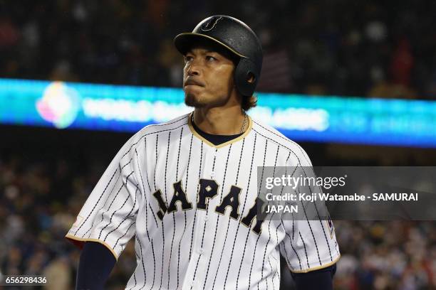 Infielder Nobuhiro Matsuda of Japan walks to the dugout after striking out in the bottom of the ninth inning during the World Baseball Classic...