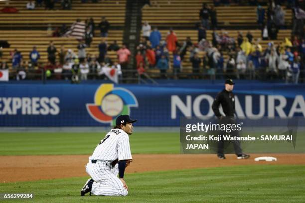 Infielder Nobuhiro Matsuda of Japan reacts after his fielding error allowing United States scoring a run to make it 2-1 in the top of the eighth...