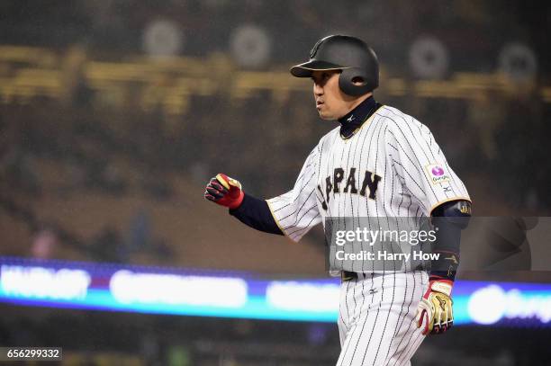 Seiichi Uchikawa of team Japan celebrates his single in the eighth inning against team United States during Game 2 of the Championship Round of the...