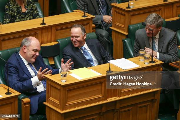 Former Prime Minister John Key enjoys a laugh with MP Steven Joyce and current Prime Minister Bill English prior to delivering his farewell speech at...