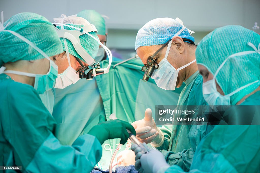 Heart surgeons during a heart operation