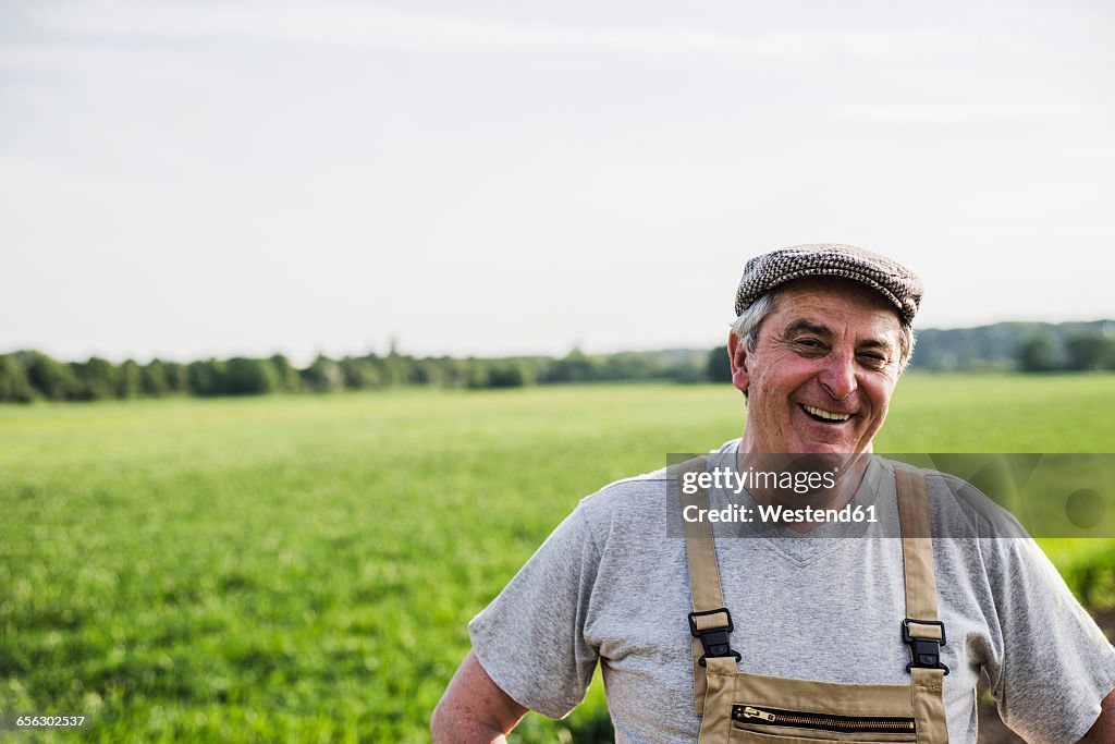 Portrait of smiling farmer at a field