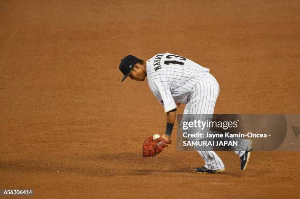Sho Nakata of team Japan fields a ball hit by Christian Yelich of team United States in the sixth inning during Game 2 of the Championship Round of...