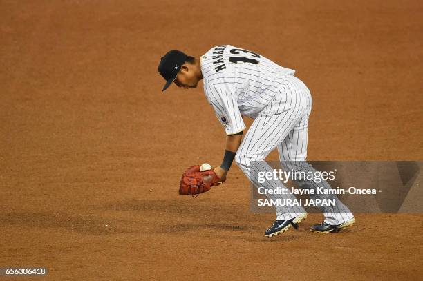 Sho Nakata of team Japan fields a ball hit by Christian Yelich of team United States in the sixth inning during Game 2 of the Championship Round of...