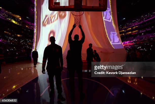 DeAndre Jordan of the Los Angeles Clippers hangs from the net during Los Angeles Lakers pre-game player introductions at Staples Center March 21 in...