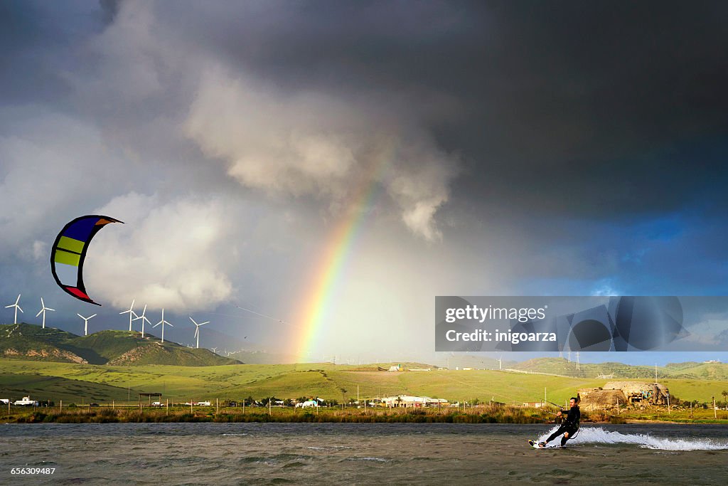 Man kite surfing at Los Lances lagoon, Tarifa, Andalucia, Spain