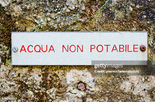 italian non-potable water sign - non potable stock pictures, royalty-free photos & images