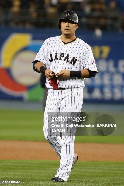 Outfielder Yoshitomo Tsutsugoh of Japan reacts after lining out in the bottom of the eighth inning during the World Baseball Classic Championship...