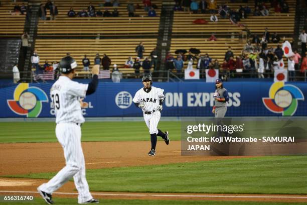 Infielder Ryosuke Kikuchi of Japan runs after hitting a solo homer in the bottom of the sixth inning during the World Baseball Classic Championship...