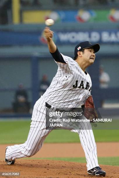 Starting pitcher Tomoyuki Sugano of Japan throws in the top of the first inning during the World Baseball Classic Championship Round Game 2 between...