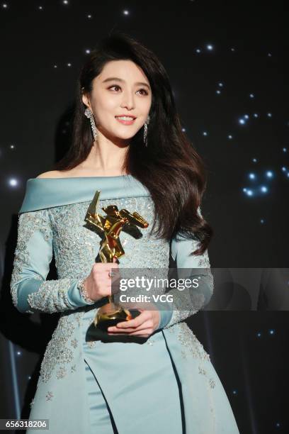 Chinese actress Fan Bingbing, winner of the Best Actress award for film 'I Am Not Madame Bovary', celebrates at the backstage of the 11th Asian Film...