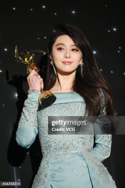 Chinese actress Fan Bingbing, winner of the Best Actress award for film 'I Am Not Madame Bovary', celebrates at the backstage of the 11th Asian Film...