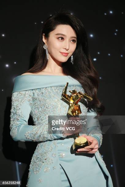 Chinese actress Fan Bingbing, winner of the Best Actress award for film 'I Am Not Madame Bovary', celebrates at the backstage of the 11th Asian Film...
