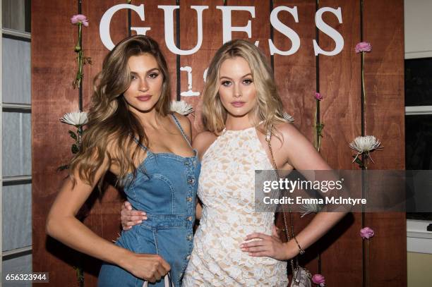 Models Simone Holtznagel and Natalie Pack attend the Guess 1981 fragrance launch at Chateau Marmont on March 21, 2017 in Los Angeles, California.