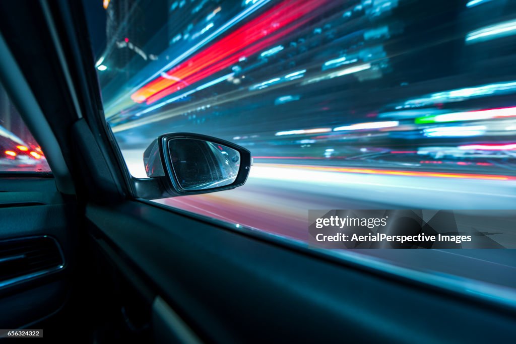 Car Driving in Downtown at Night