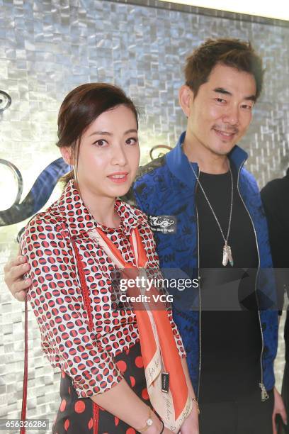 Hong Kong billionaire Joseph Lau Luen Hung's wife Chan Hoi-wan, singer and actor Richie Jen Hsien-chi attend the opening ceremony of a sport brand's...