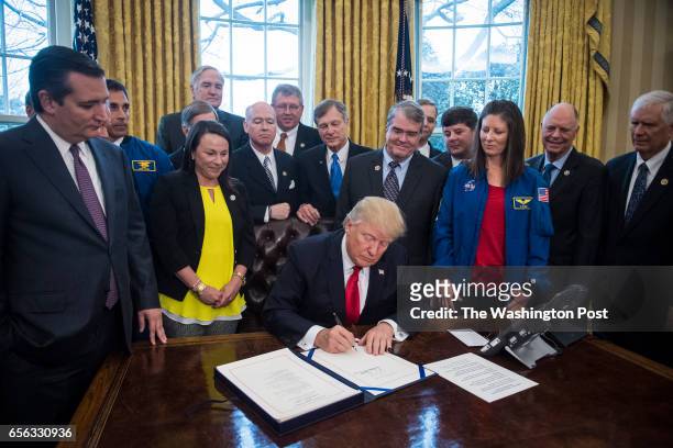 President Donald Trump signs a bill to increase NASA's budget to $19.5 billion and directs the agency to focus human exploration of deep space and...