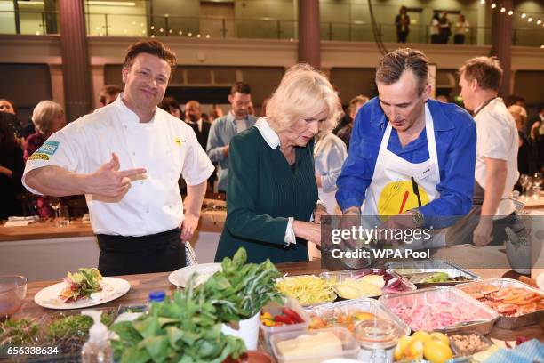 Camilla, Duchess of Cornwall, the patron of UK Harvest, chef Jamie Oliver and Peter Harding, CEO of Lucozade Ribena Suntory, attend the CEO Cook Off...