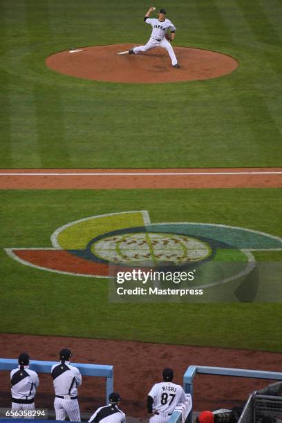 Tomoyuki Sugano of Japan pitches during the Game 2 of the Championship Round of the 2017 World Baseball Classic between United States and Japan at...