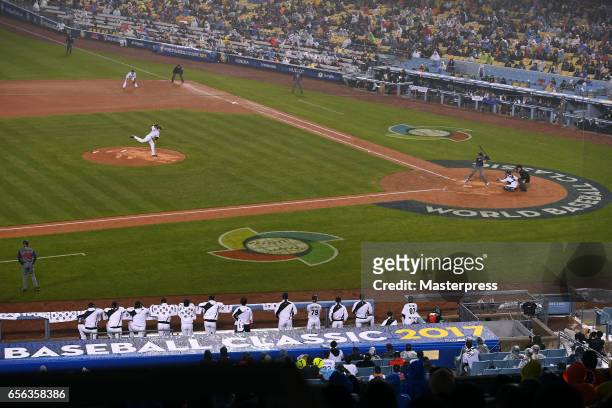 Tomoyuki Sugano of Japan pitches during the Game 2 of the Championship Round of the 2017 World Baseball Classic between United States and Japan at...