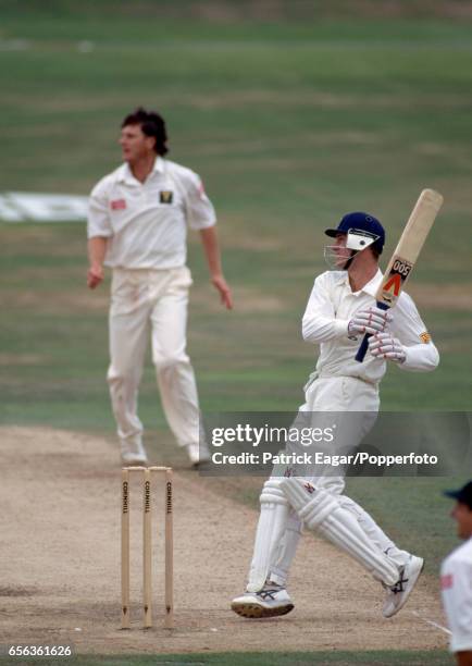 John Crawley of England dispatches a delivery from South Africa bowler Brian McMillan during the 2nd Test match between England and South Africa at...