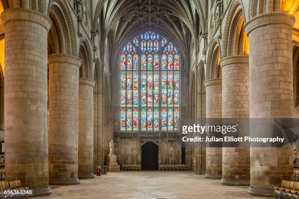the nave of gloucester cathedral. - stained glass church stock pictures, royalty-free photos & images