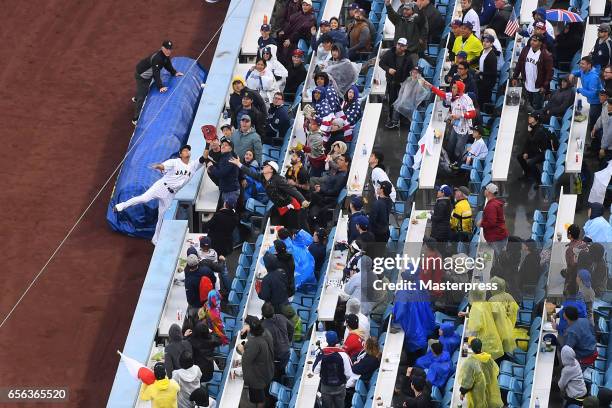 Sho Nakata of Japan catches a pop foul during the Game 2 of the Championship Round of the 2017 World Baseball Classic between United States and Japan...