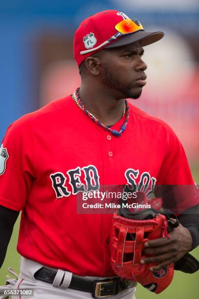 Rusney Castillo of the Boston Red Sox signs autographs before the Spring Training game against the Toronto Blu Jays at Florida Auto Exchange Stadium...