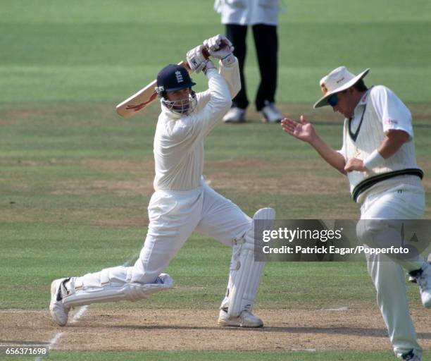 England batsman John Crawley drives past Australian fielder Mark Waugh during the 2nd Test match between England and Australia at Lord's Cricket...