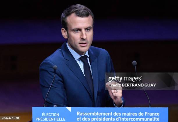 French presidential candidate for the "En Marche" movement Emmanuel Macron delivers a speech during an exceptional gathering of mayors of France and...