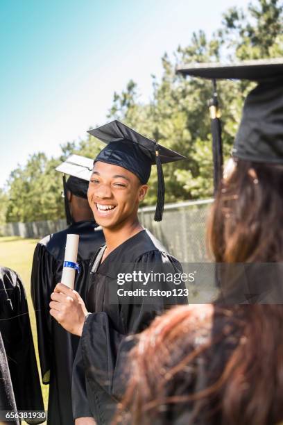 african descent college, high school student waits at graduation. - secondary school certificate stock pictures, royalty-free photos & images