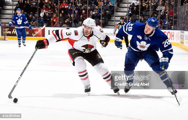 Brandon Gormley of the Binghamton Senators controls the puck against Kasperi Kapanen of the Toronto Marlies on March 18, 2017 at Air Canada Centre in...