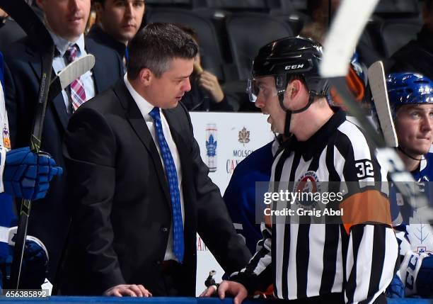 Head coach Sheldon Keefe of the Toronto Marlies gets an explanation from Referee Troy Murray against the Binghamton Senators on March 18, 2017 at Air...