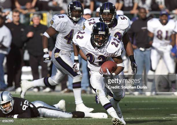 Duane Starks of the Baltimore Ravens runs an interception back against the Oakland Raiders during the AFC Championship game at Network Associates...