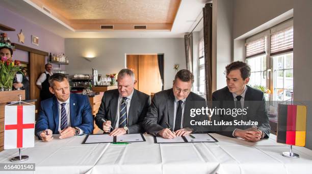 Martin Glenn , FA Chairman Greg Clarke, DFB president Reinhard Grindel and DFB general secretary Friedrich Curtius sign a memorandum of understanding...