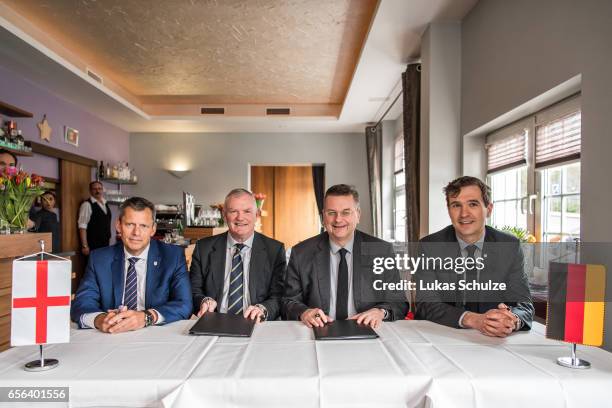 Martin Glenn , FA Chairman Greg Clarke, DFB president Reinhard Grindel and DFB general secretary Friedrich Curtius sign a memorandum of understanding...