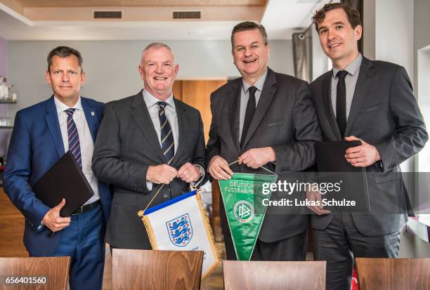 Martin Glenn , FA Chairman Greg Clarke, DFB president Reinhard Grindel and DFB general secretary Friedrich Curtius pose after signing a memorandum of...