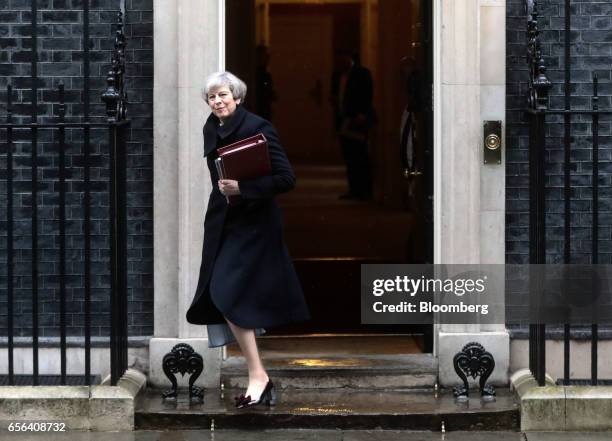 Theresa May, U.K. Prime minister, leaves 10 Downing Street to attend the House of Commons in London, U.K., on Wednesday, March 22, 2017. Senior...